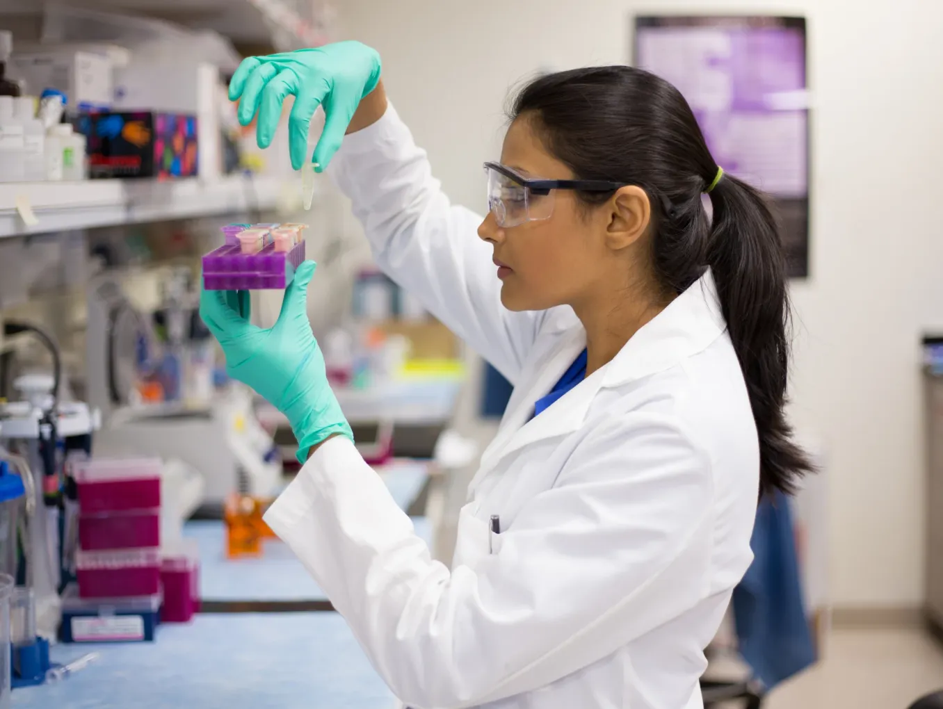 woman in a lab conducting an experiment