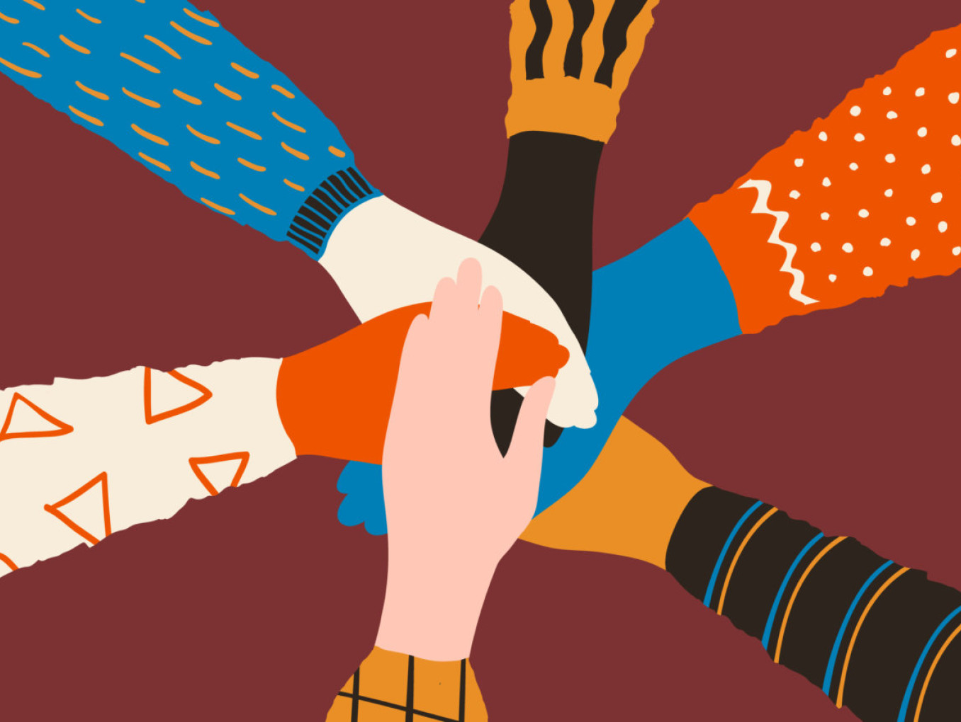 Diverse hands united together.