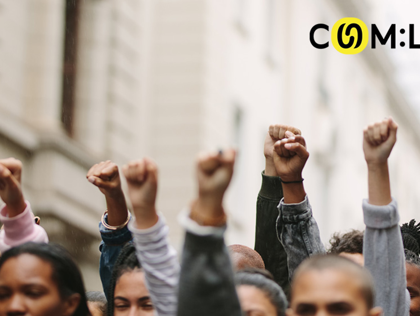 people raising their hands in protest