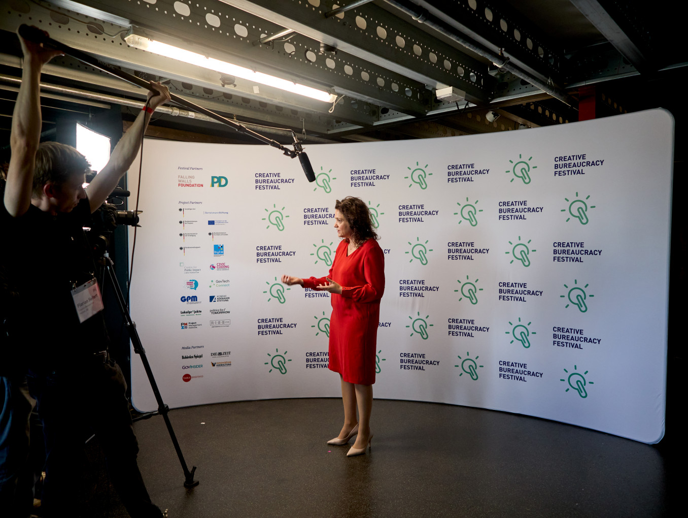 interview of Sarah Ryglewski infront of the press wall