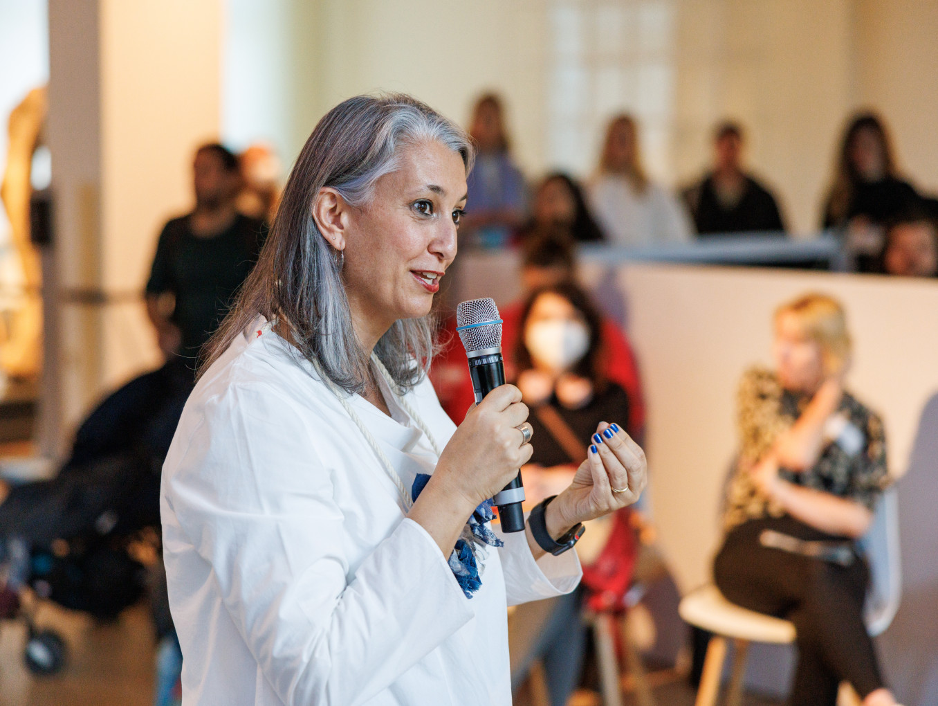 A portrait of a woman with a microphone. 