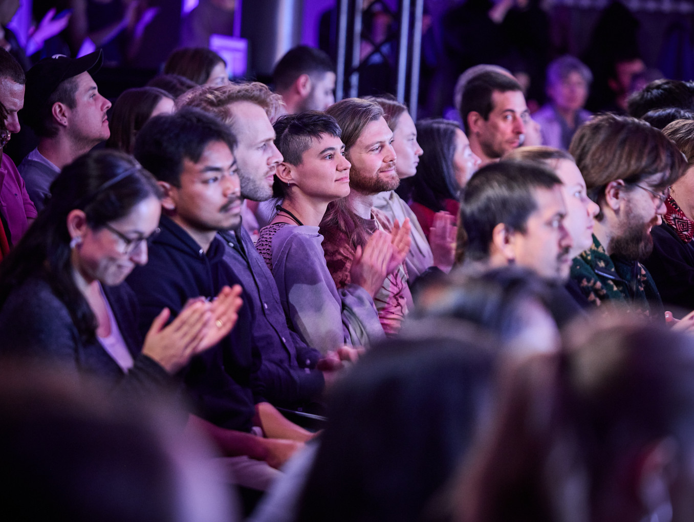 A group of people claps