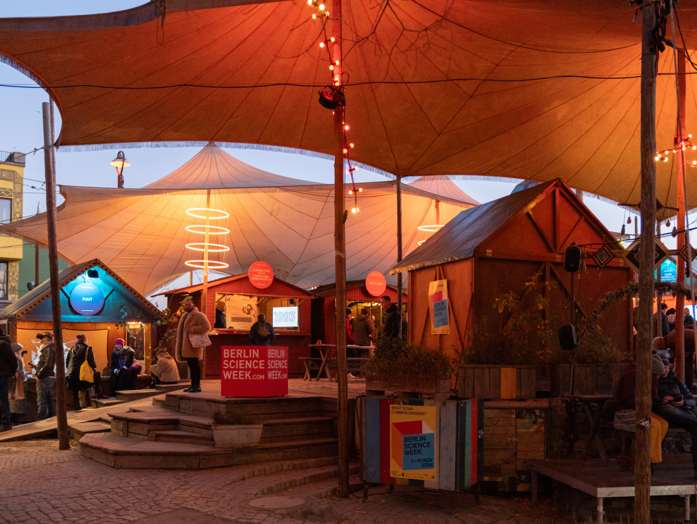 A bright festival tent at Holzmarkt 25. 