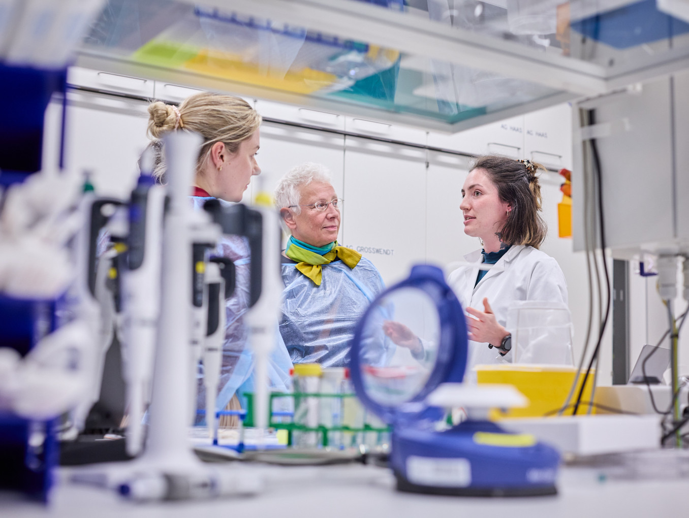 People stand in a laboratory 