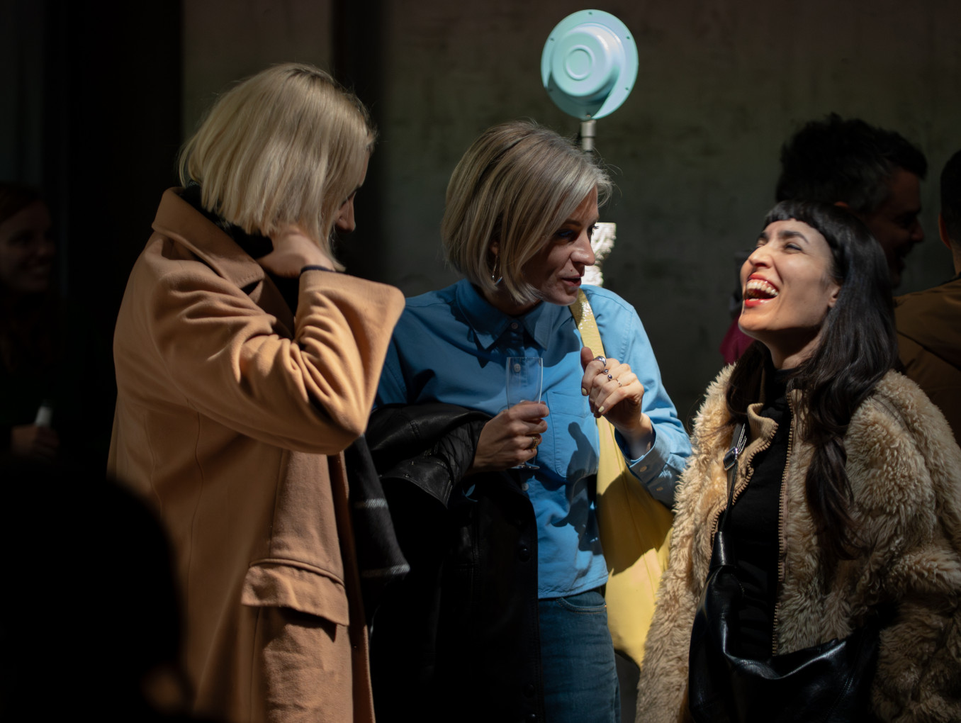 A group of women laughing and smiling