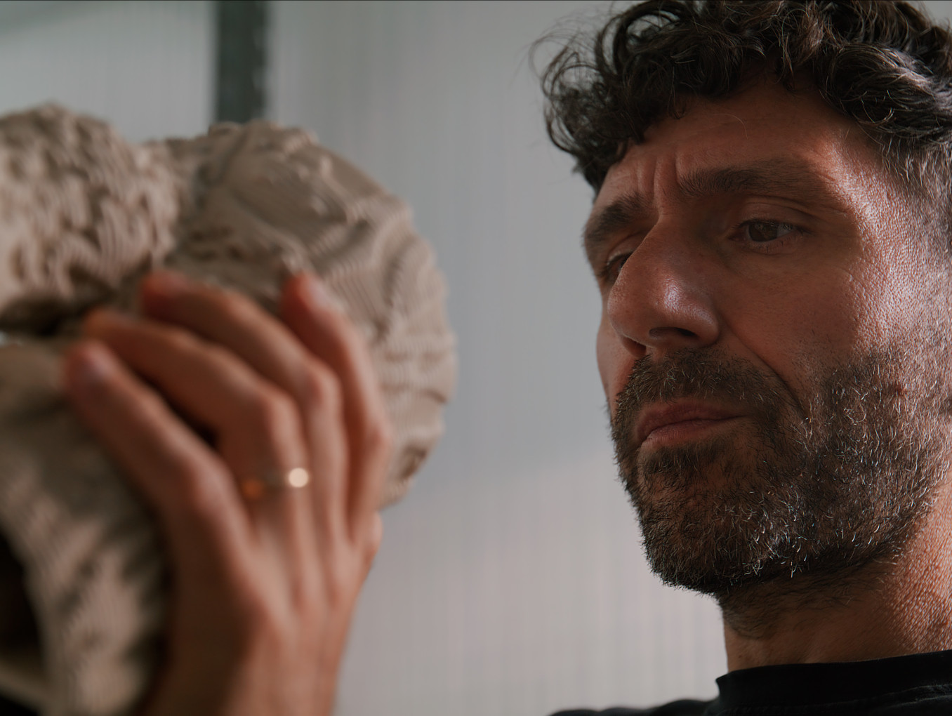 Marco Barotti holding a statue