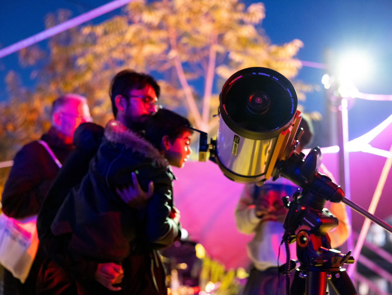 people looking through a telescope | star gazing