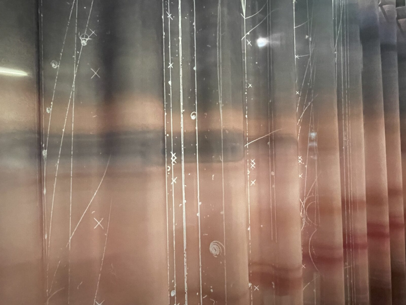 Artistic image of repeated parts of photograph of woman's face