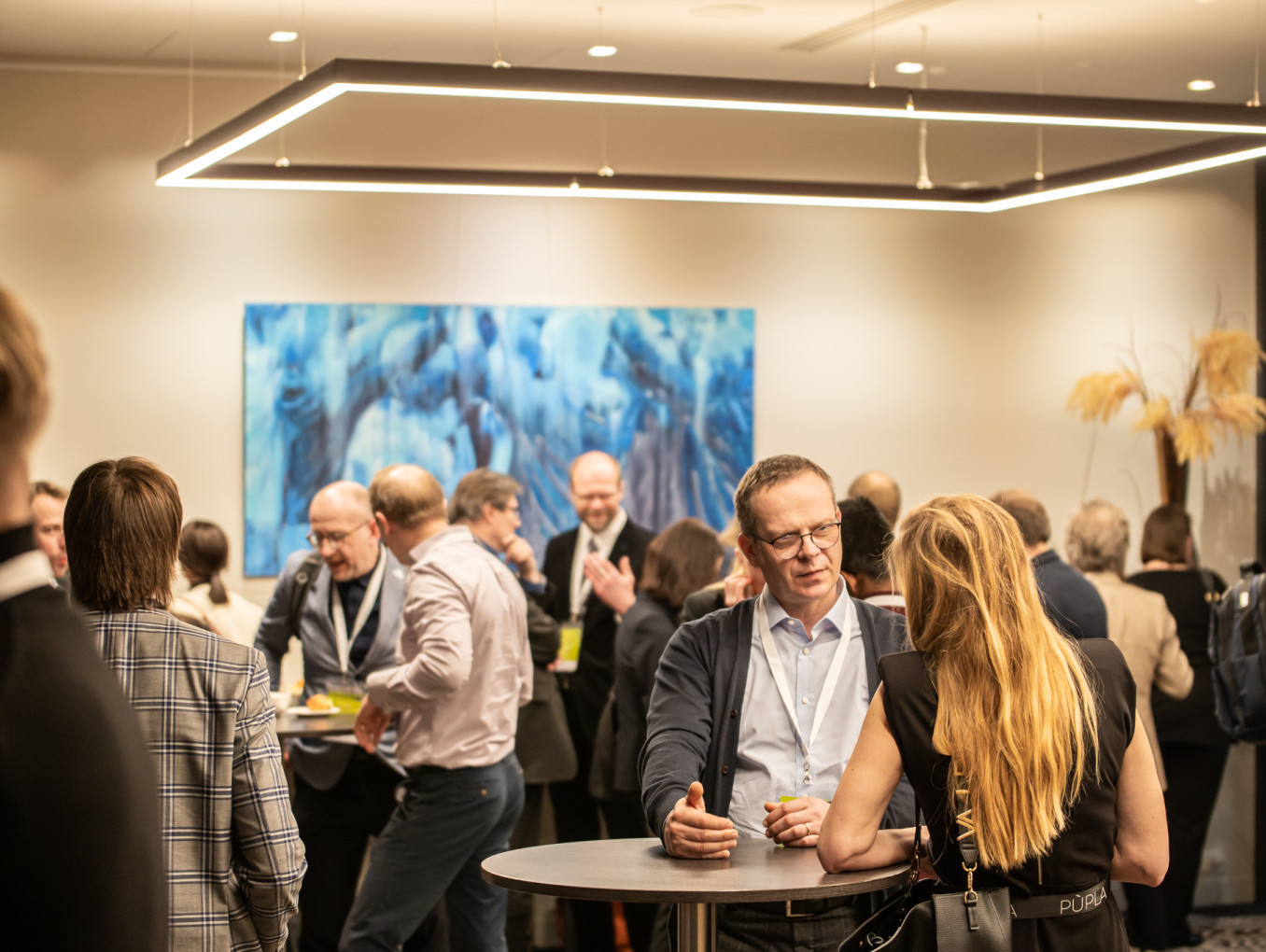 Participants engaging in networking, exchanging ideas, and building connections during the event