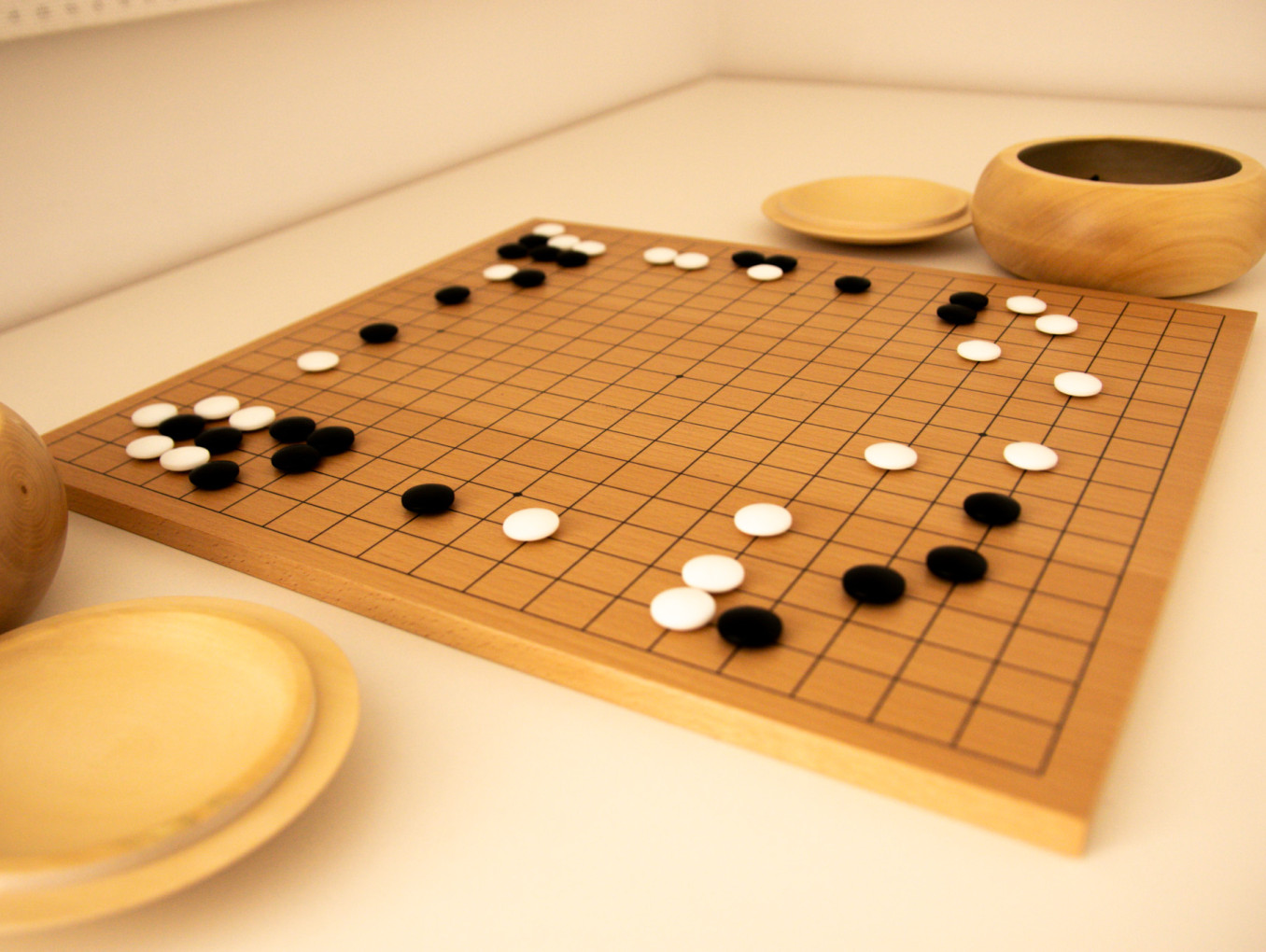 Board game Go: black and white stones on a Go board