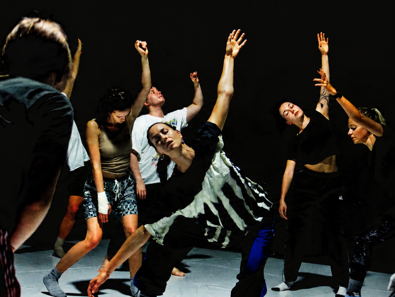 People dancing with arms outstretched