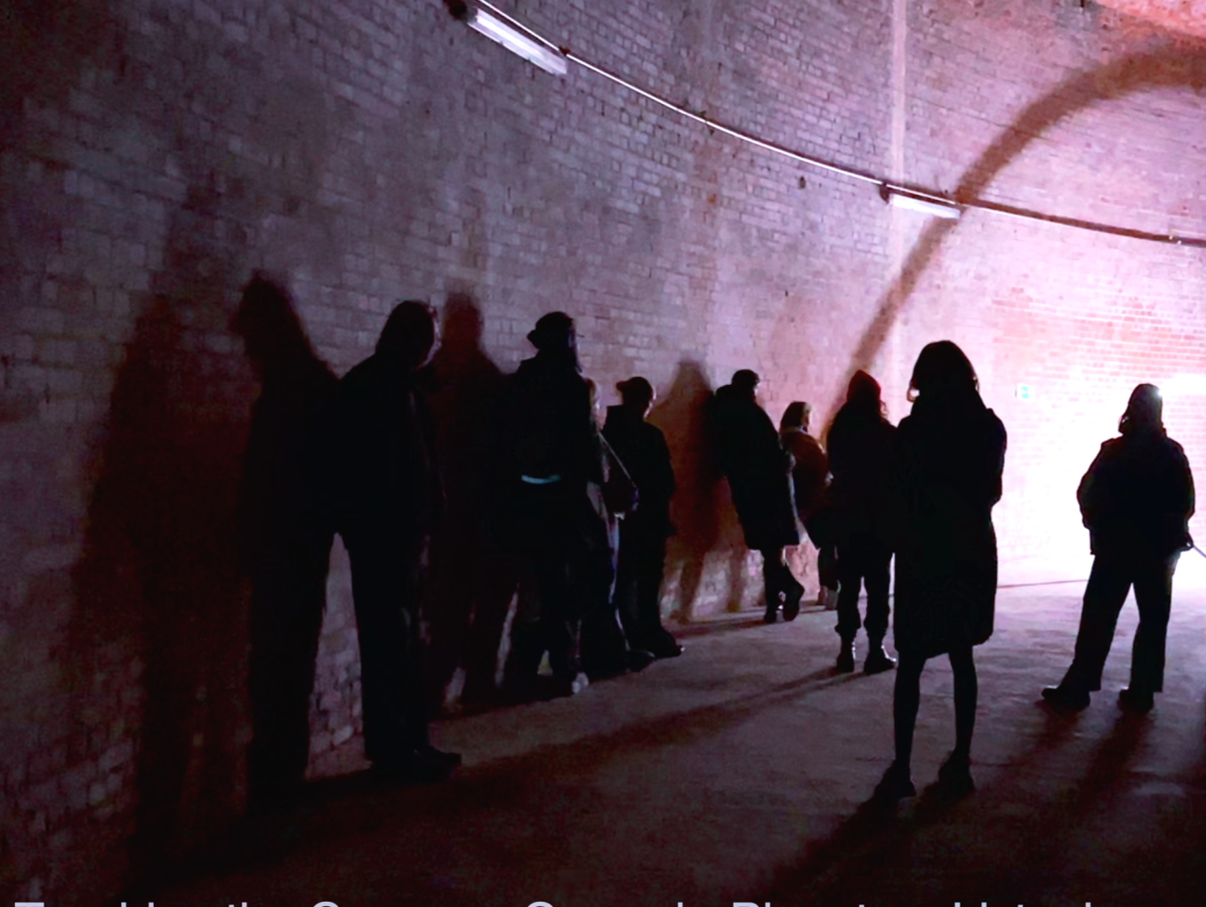 Photo of people inside dimly lit space