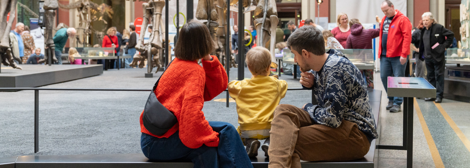 A family sits at a museum 