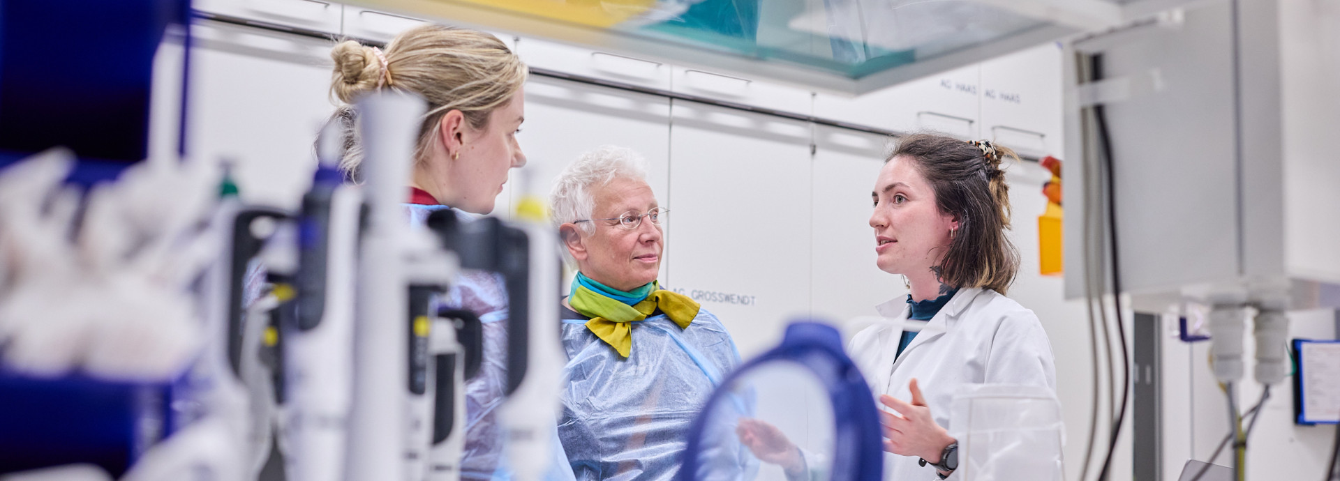 People stand in a laboratory 