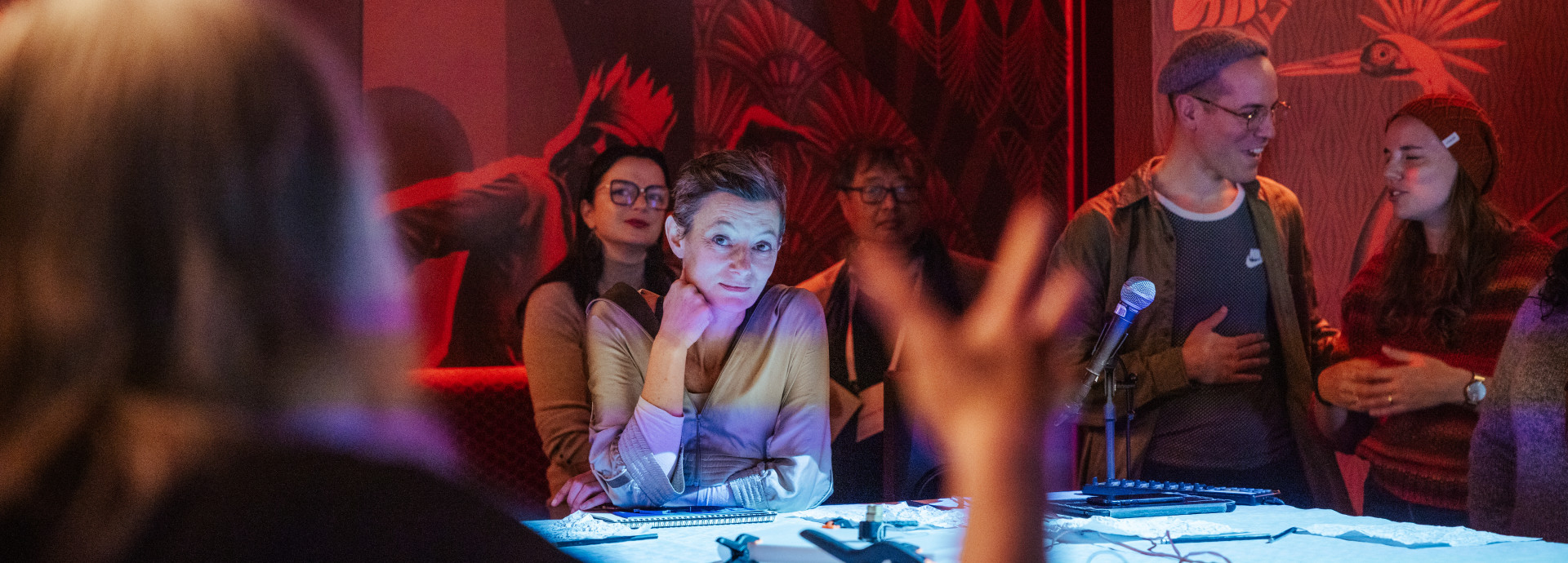 A woman looks across a table