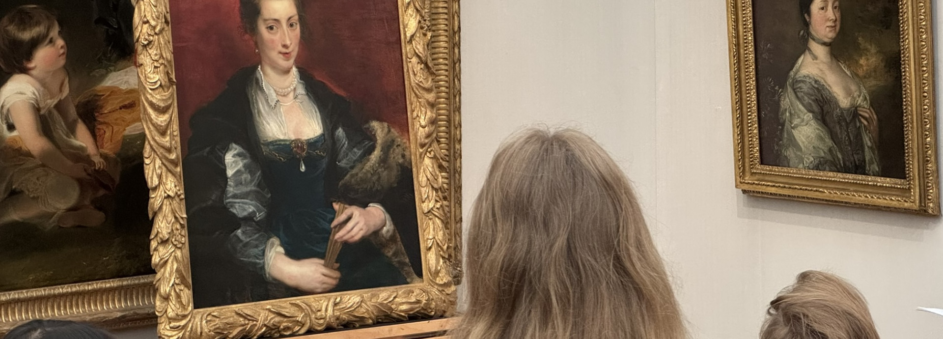 Person looking at an oil painting