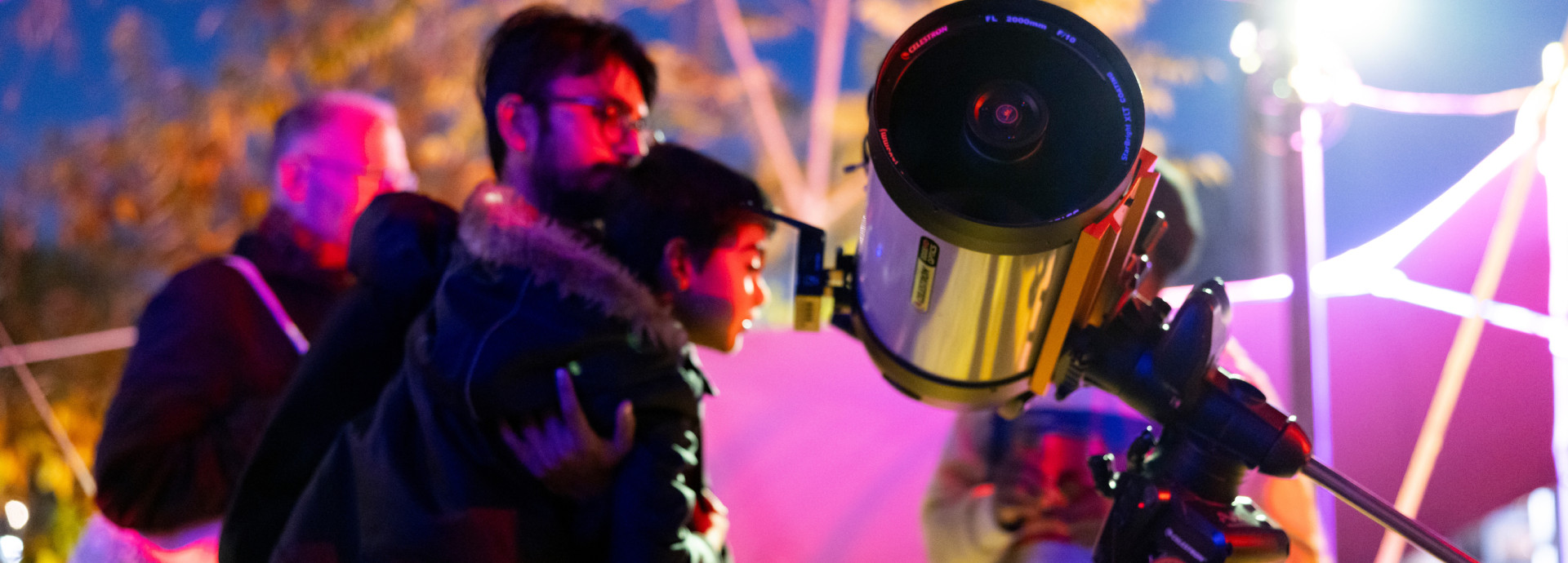 people looking through a telescope | star gazing