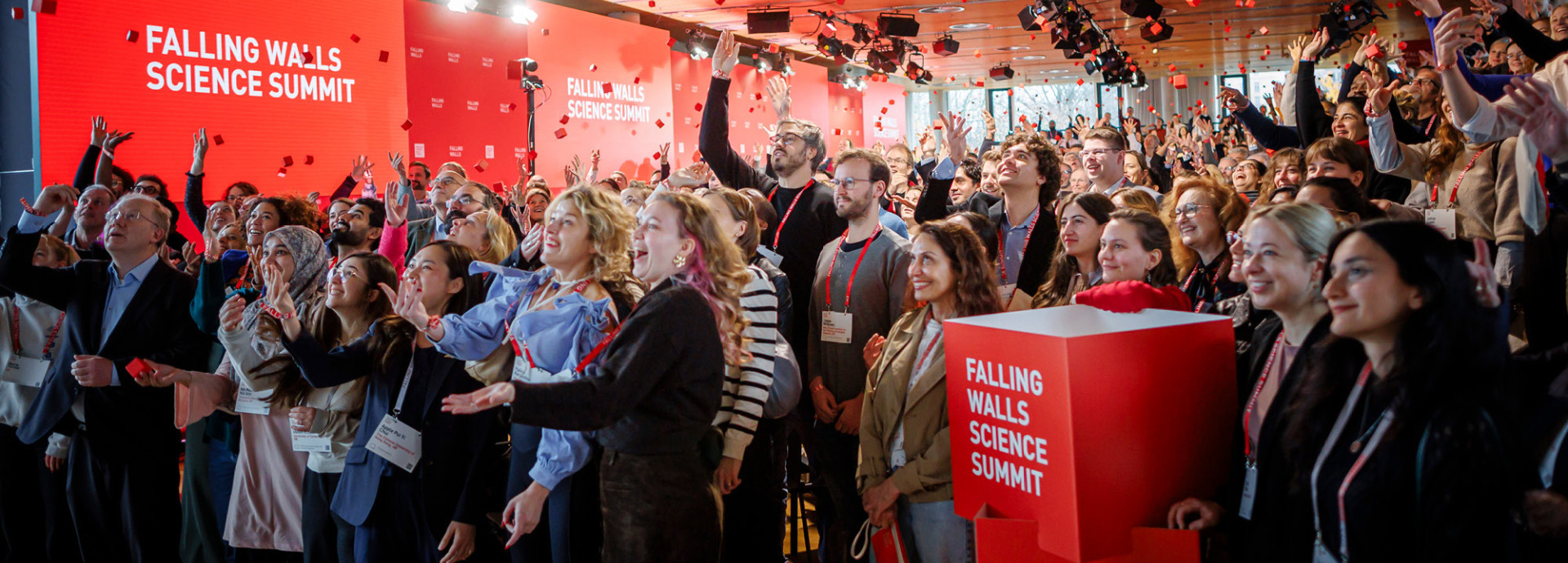 Crowd cheering at end of conference.