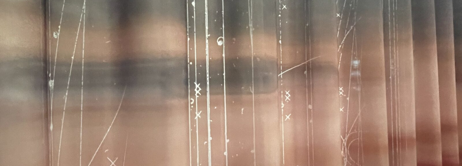 Artistic image of repeated parts of photograph of woman's face