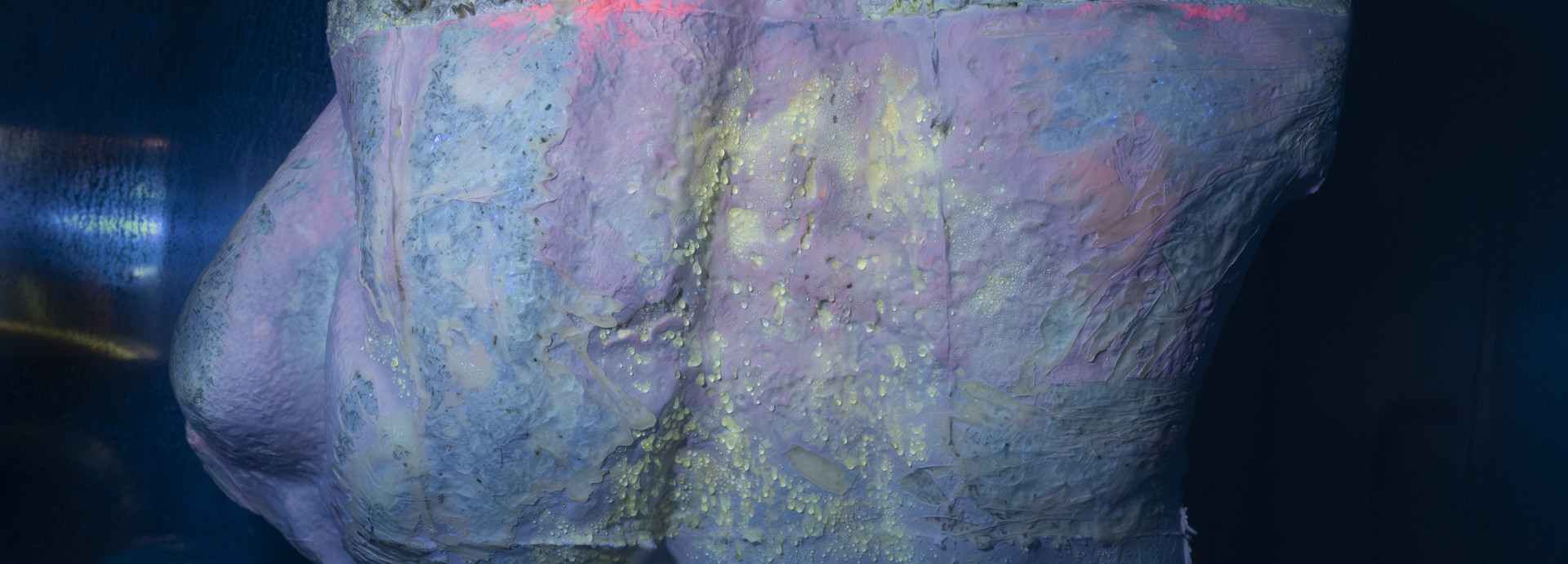 Mycelium sculpture of Dionysos-Torso under UV-light