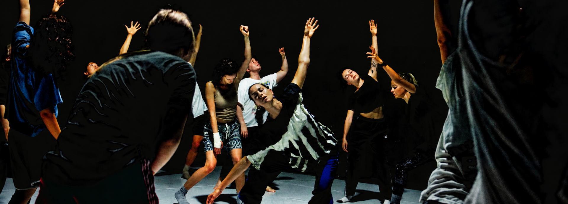 People dancing with arms outstretched