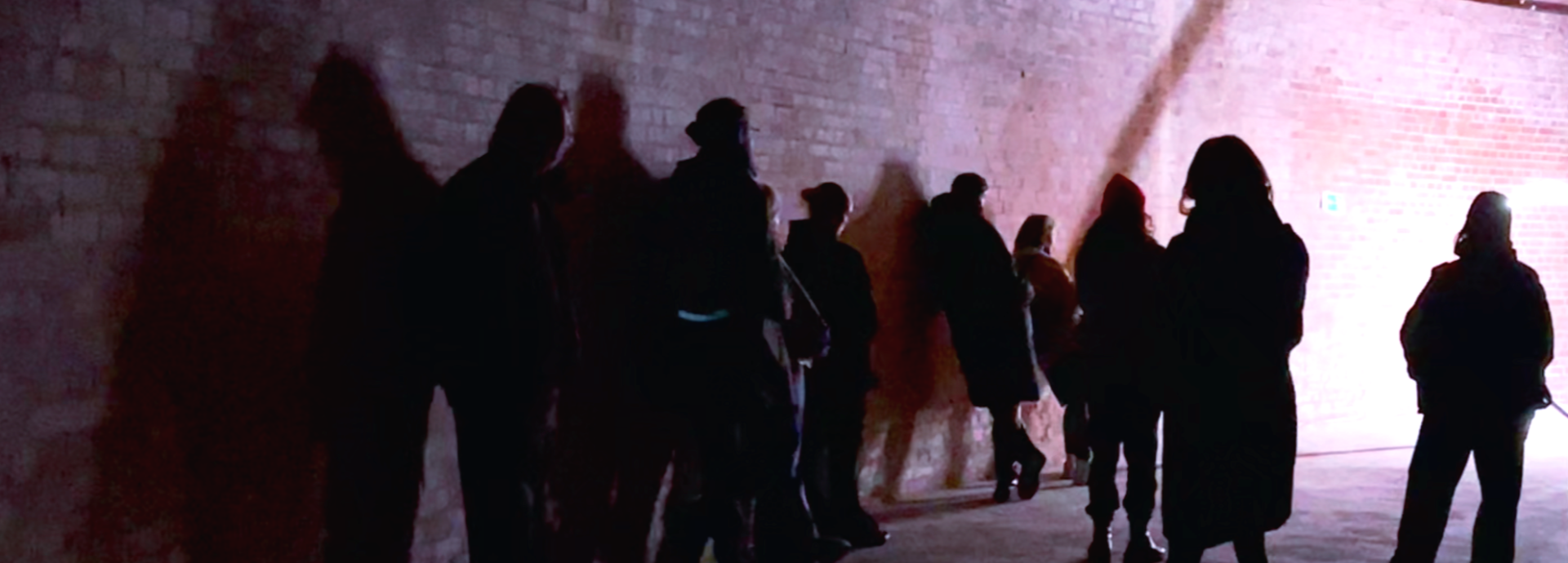 Photo of people inside dimly lit space