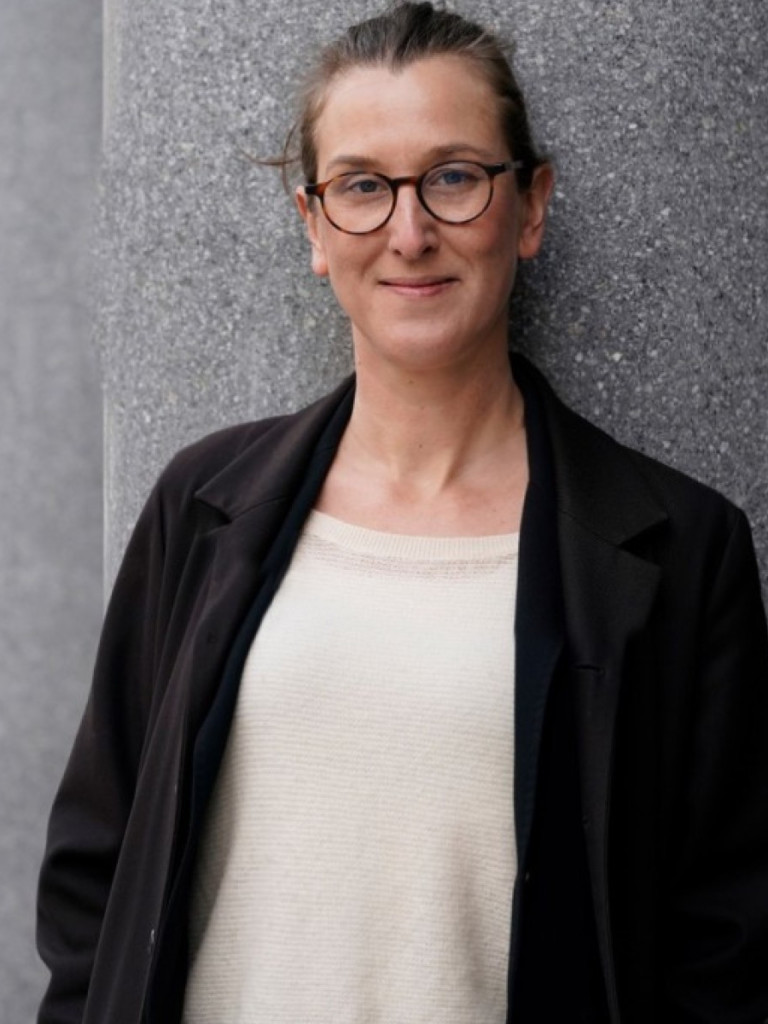 Woman wearing glasses.