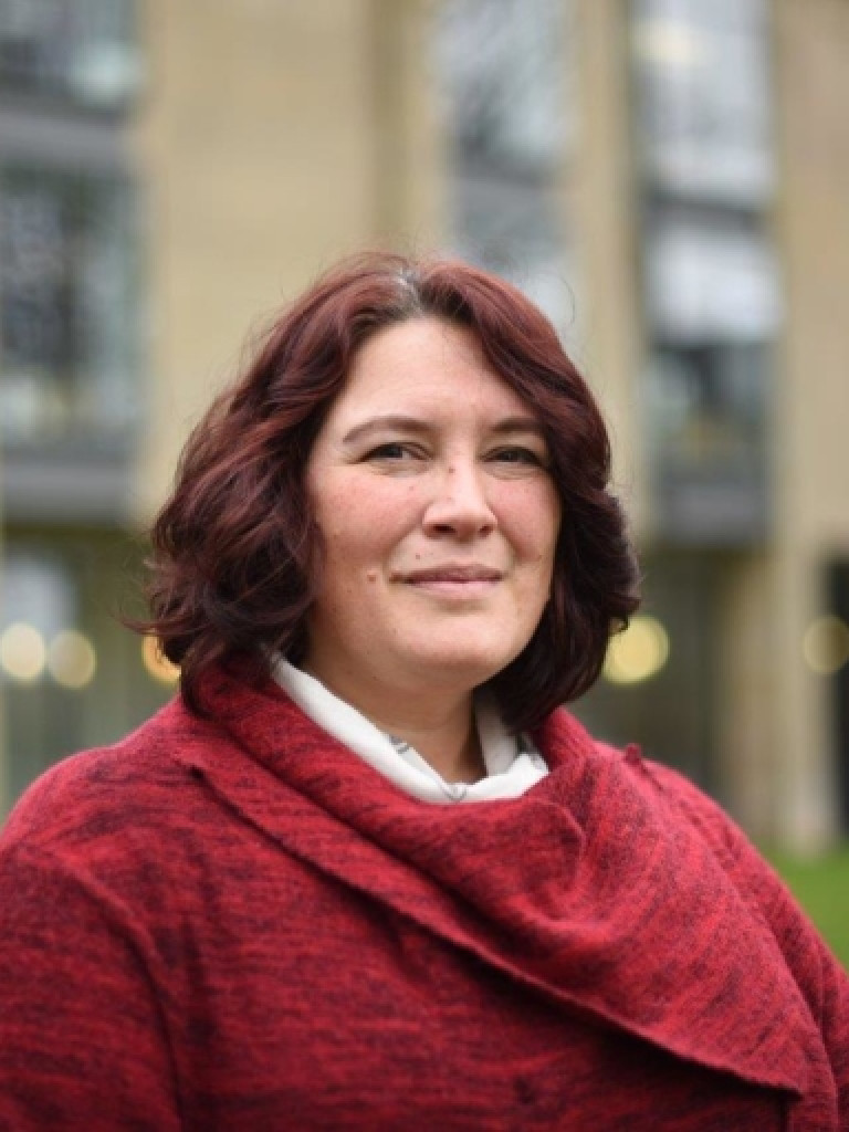 Woman in red sweater.