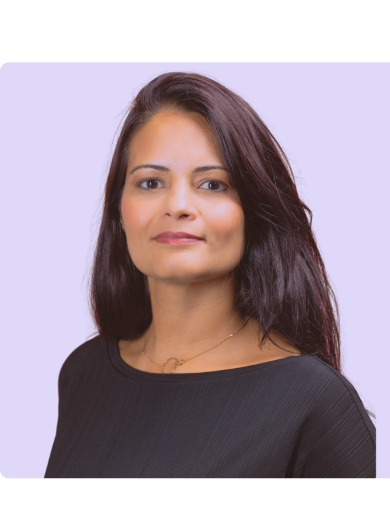 light violet background, Daniela is brown skin, looking straight with a slight smile, long dark hairs, black t-shirt