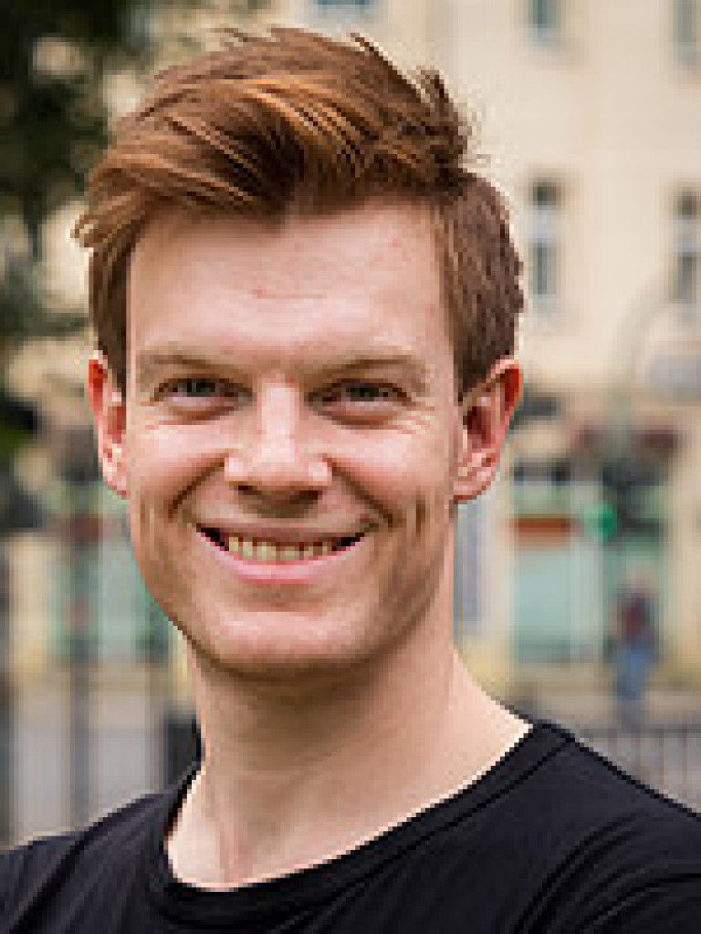 Headshot of Ian Erik Stewart smiling