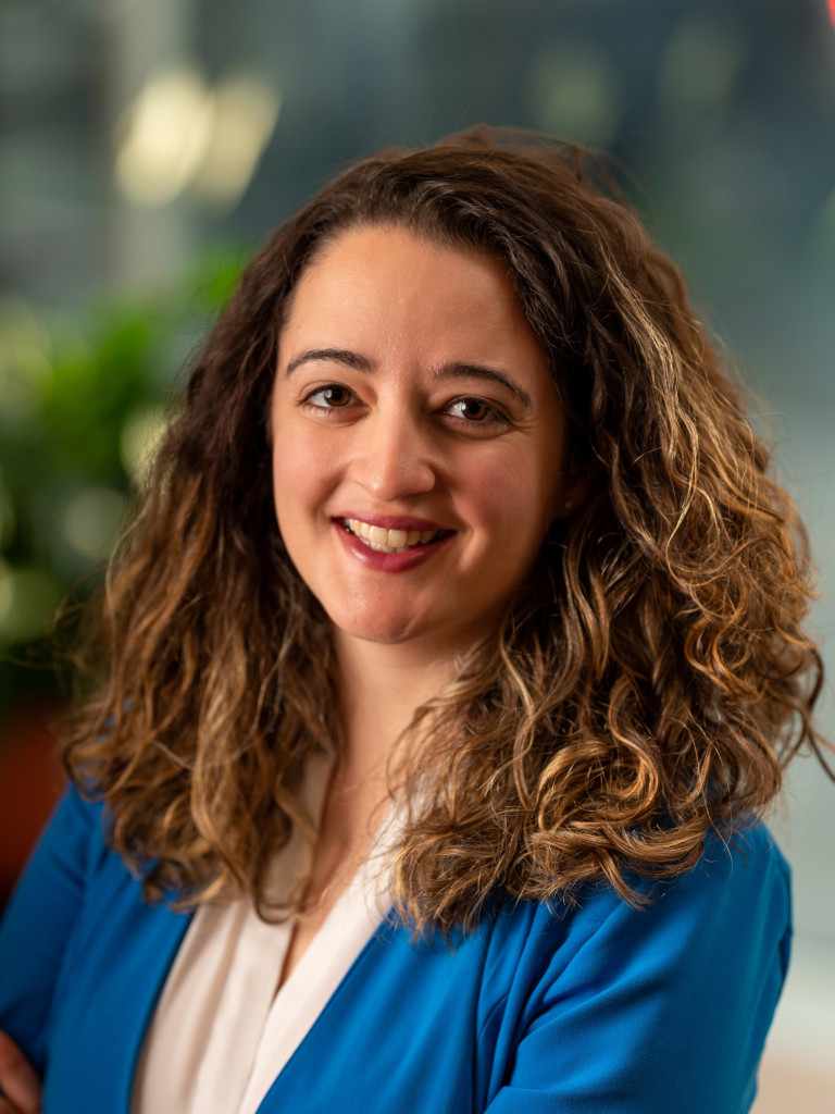 Dr. Hillary Briffa is looking at the camera, smiling