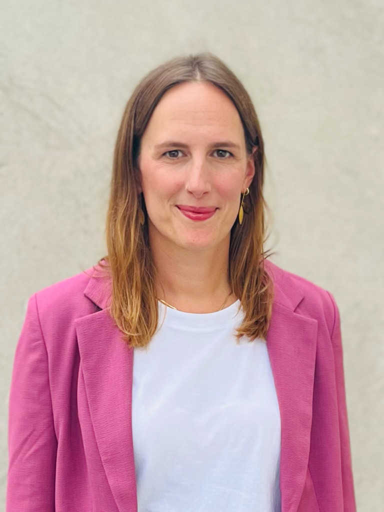 dark blond women with pink blazer