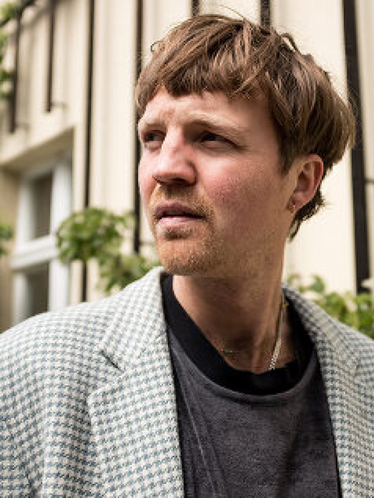 man with short bright hair