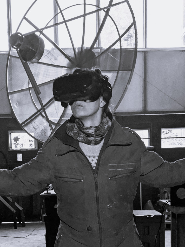 Artist with VR glasses operating their radio telescope