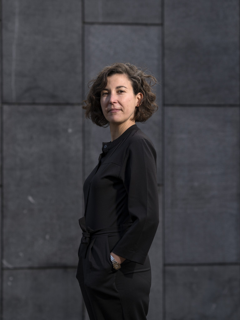 A professional headshot of Barbara Cueto, smiling and dressed in black.