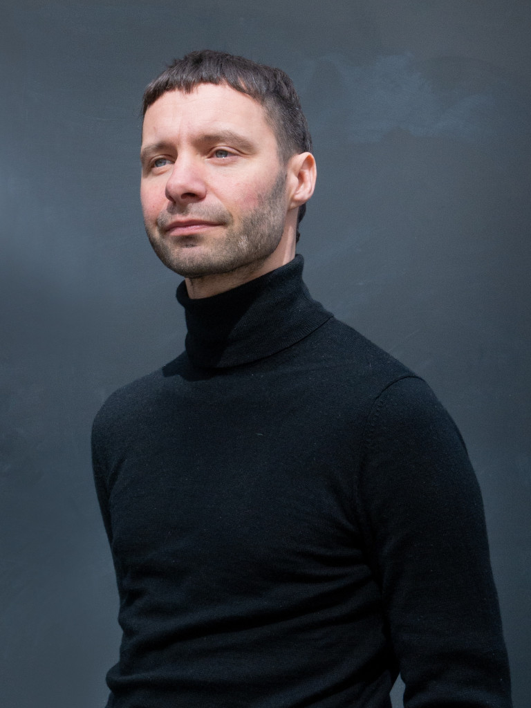 Portrait of the composer and sound researcher Julius, in black sweater and short hair.