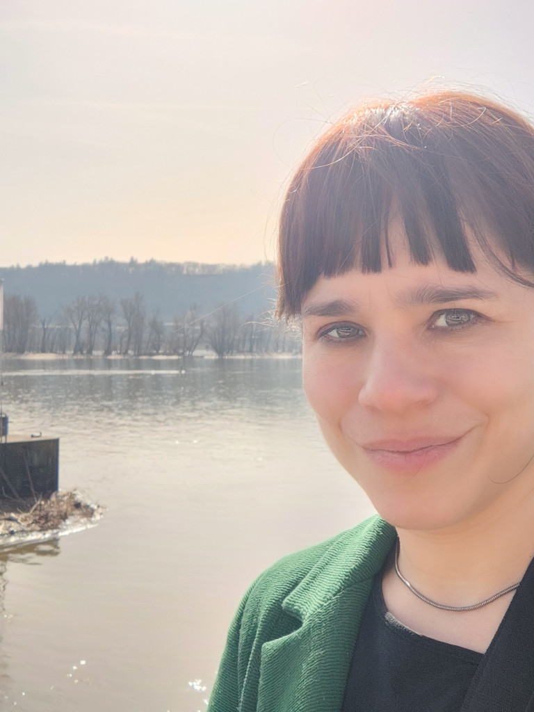 Woman in front of lake