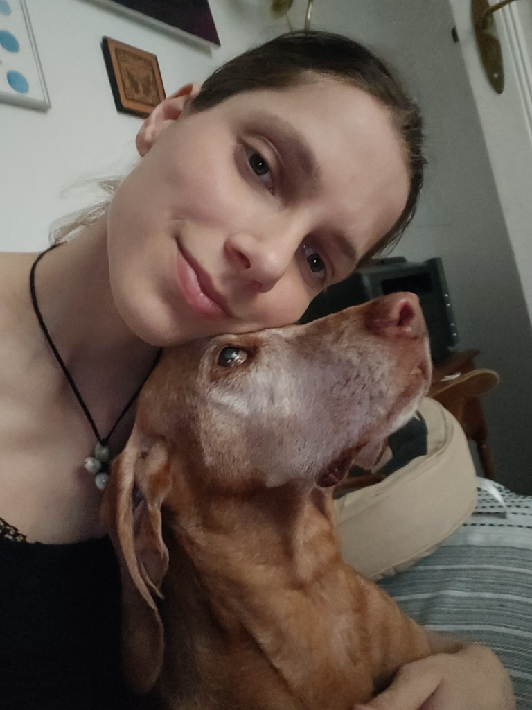 Portrait of Alexandra Forrai with her dog