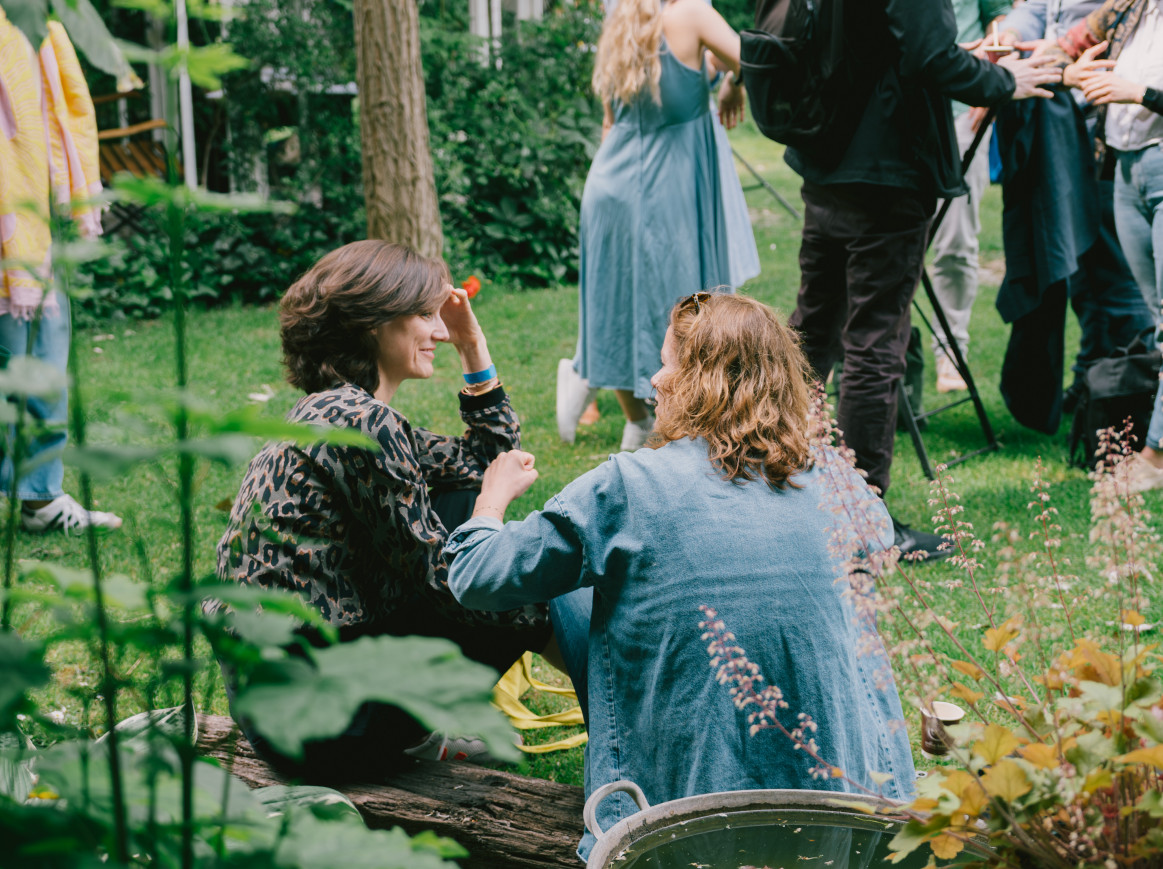 people sitting on the grass outside 