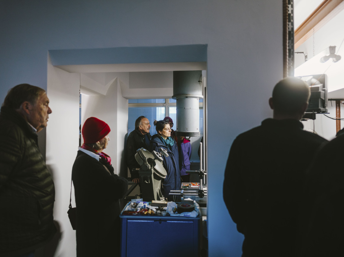 People stand inside a lab