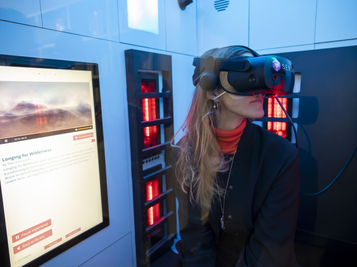 A woman wears VR glasses