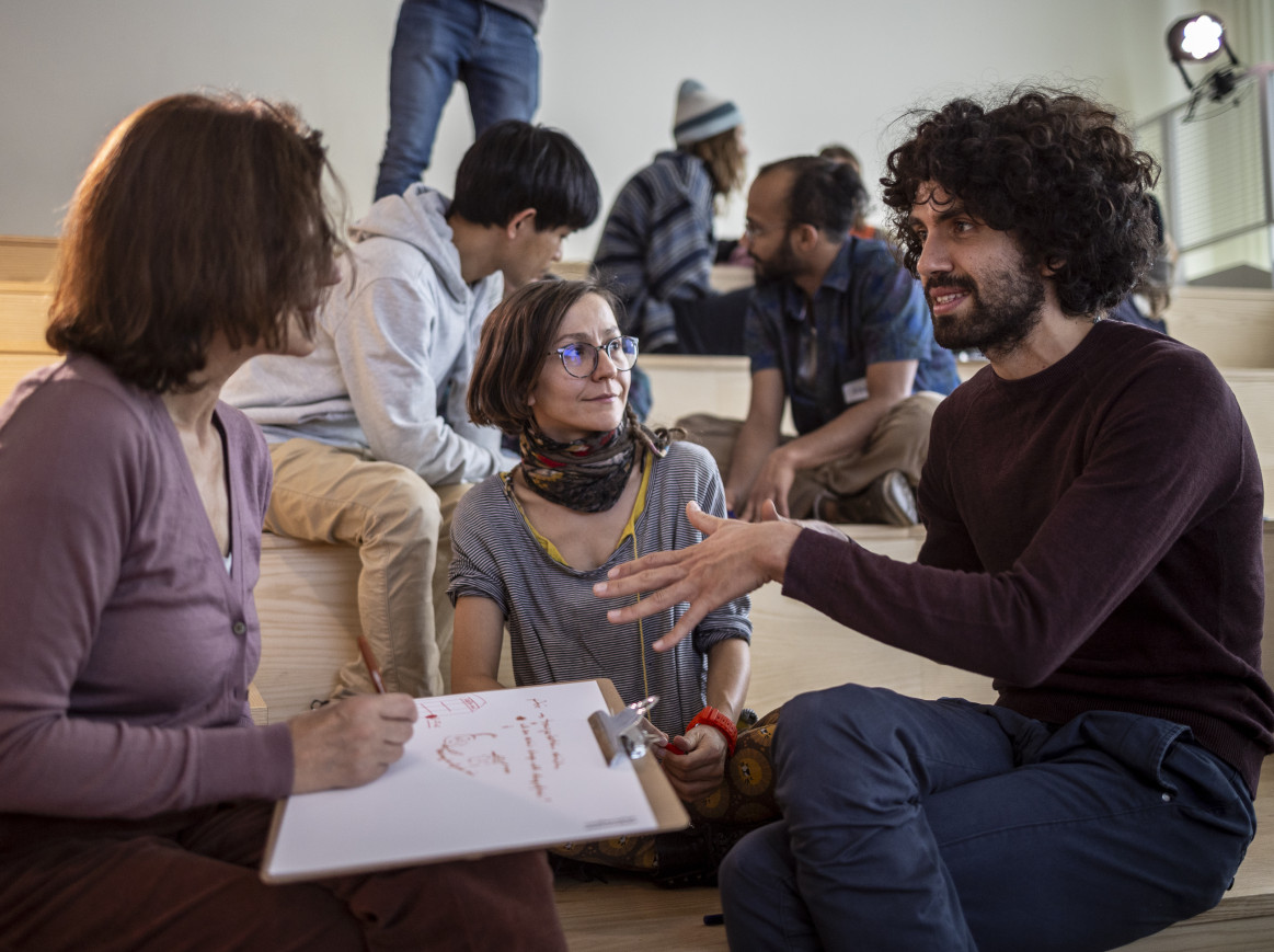 People speaking to each other