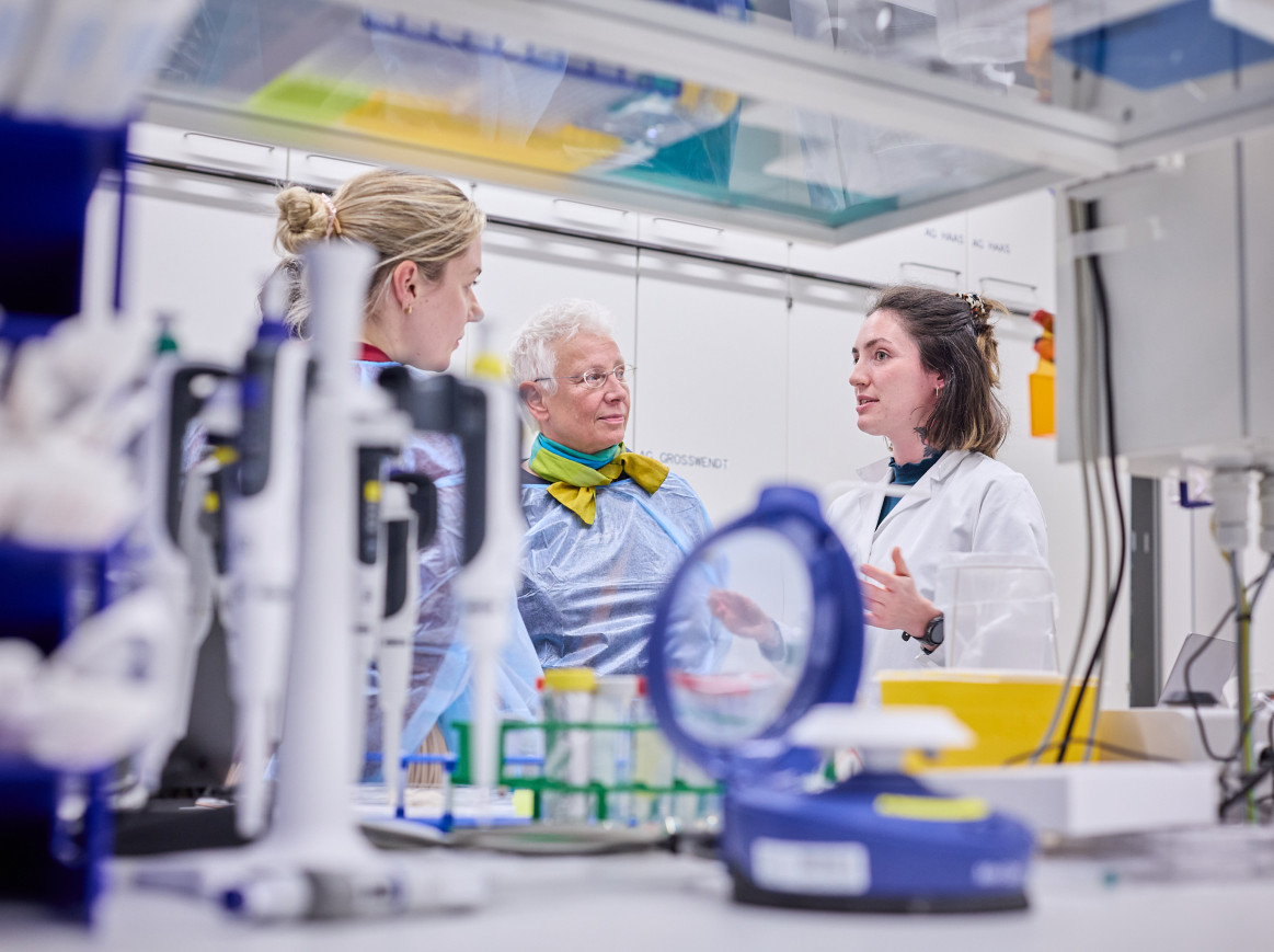 3 people speaking in a lab