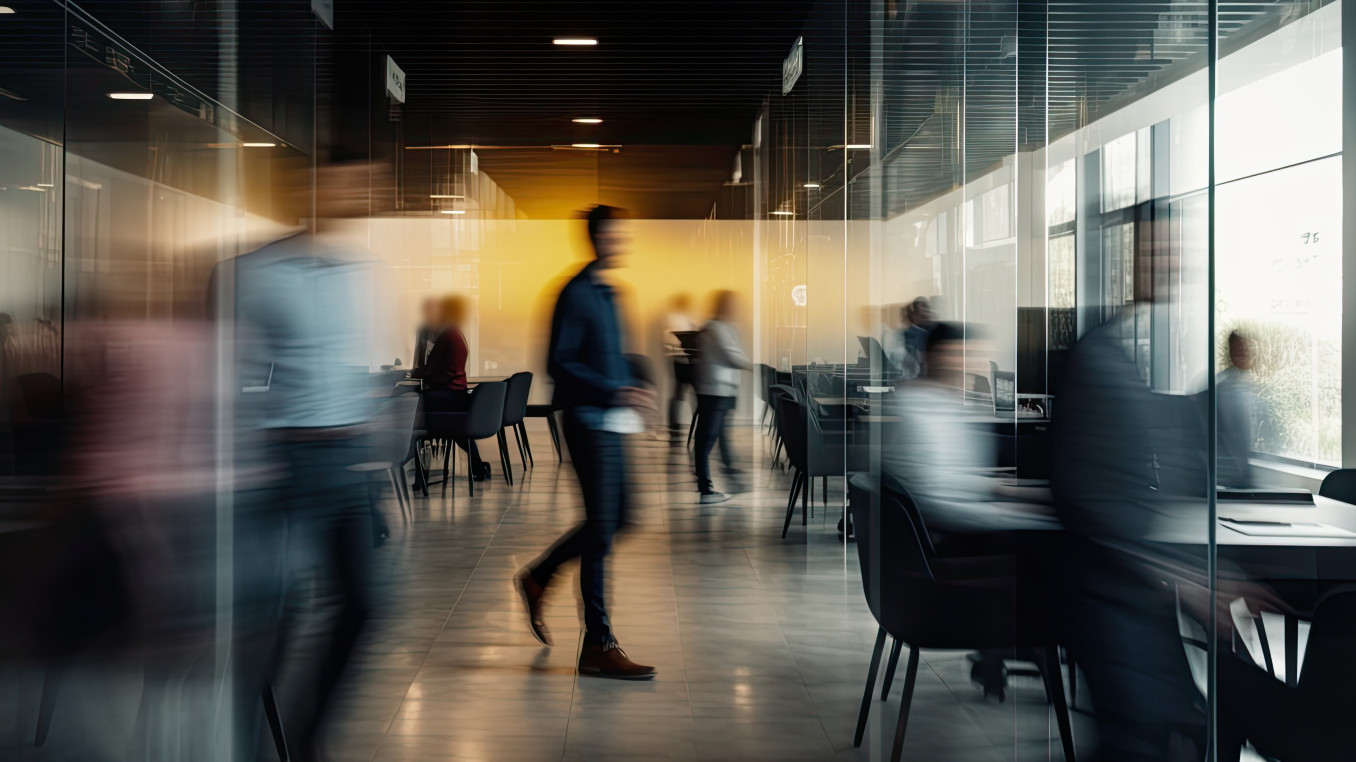 A blurry image of works in an office