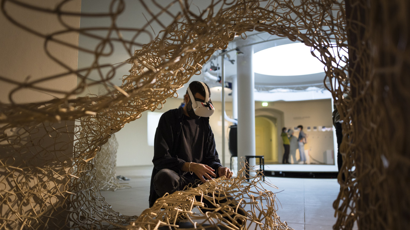 Person using VR in installation