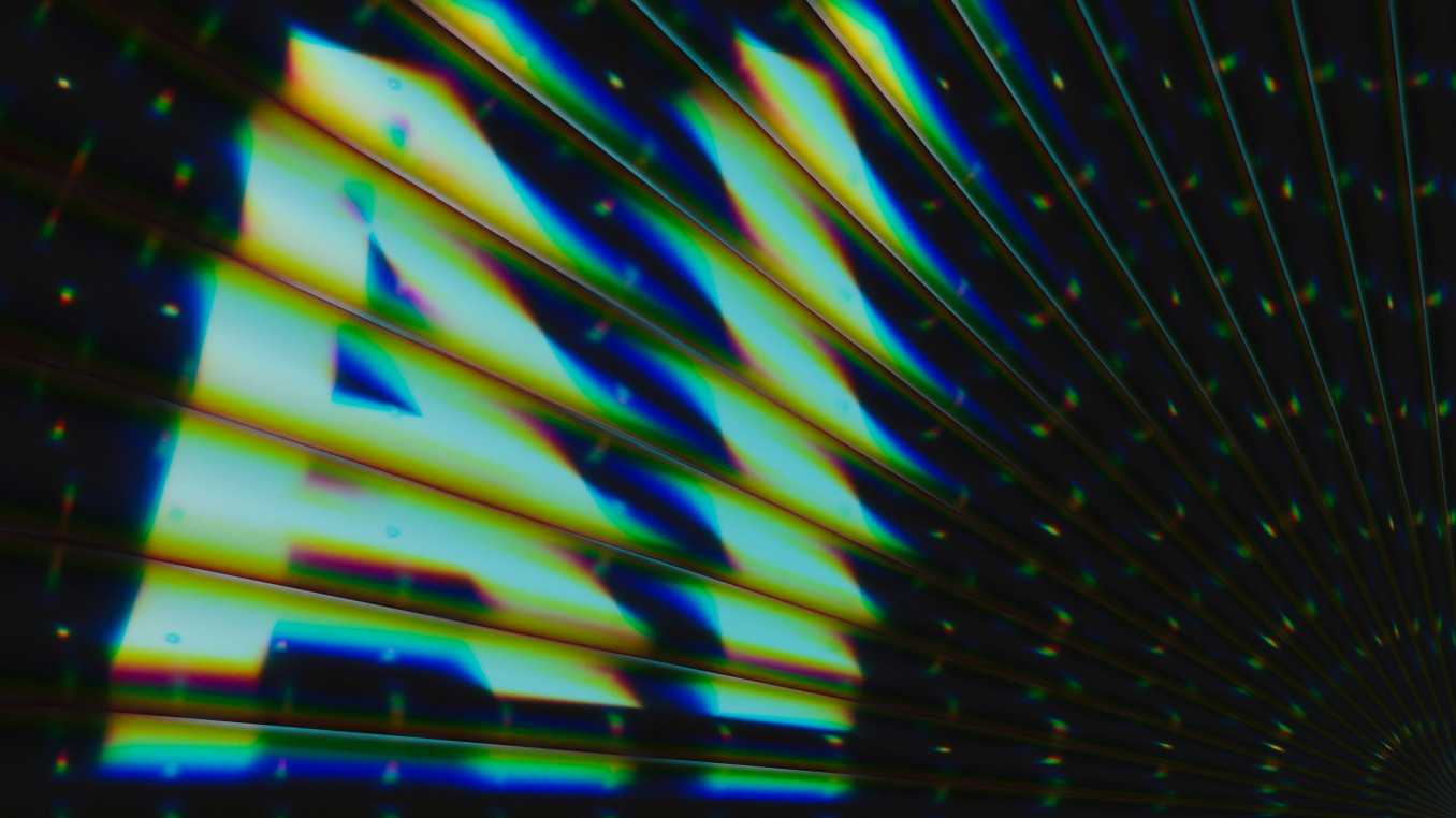 A shimmering text saying "AI".