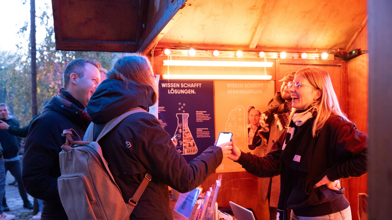 A woman shares her research with the public. 