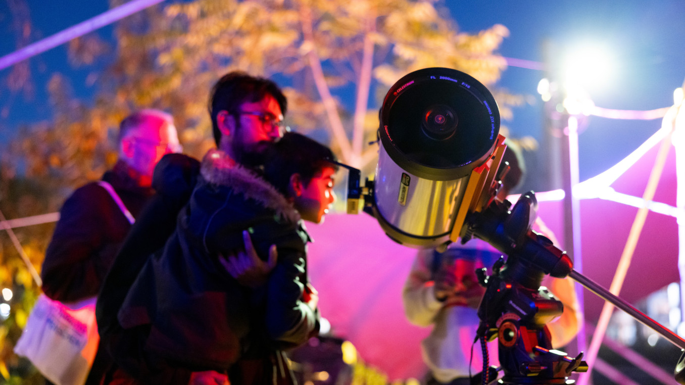 people looking through a telescope | star gazing