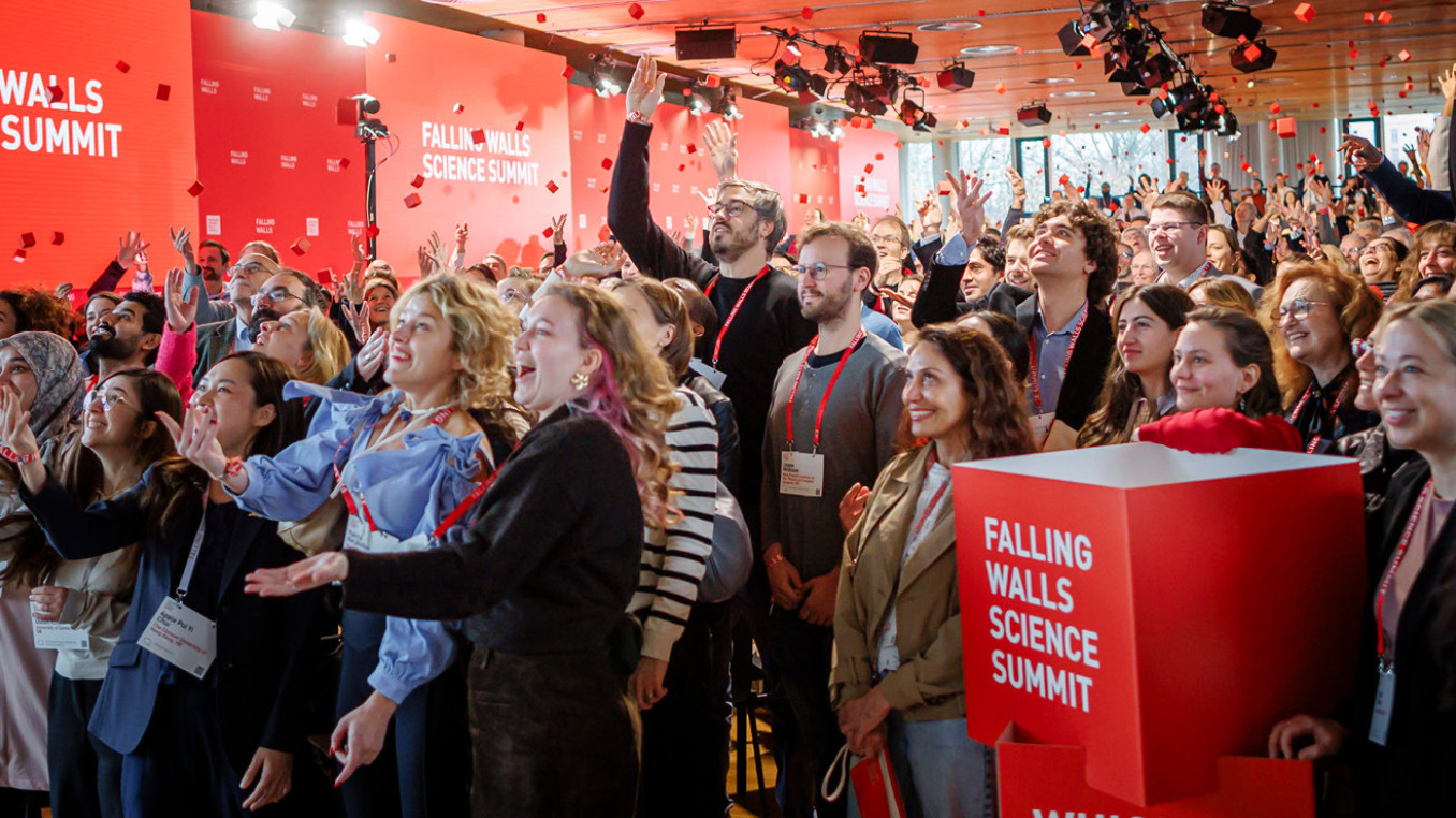 Crowd cheering at end of conference.