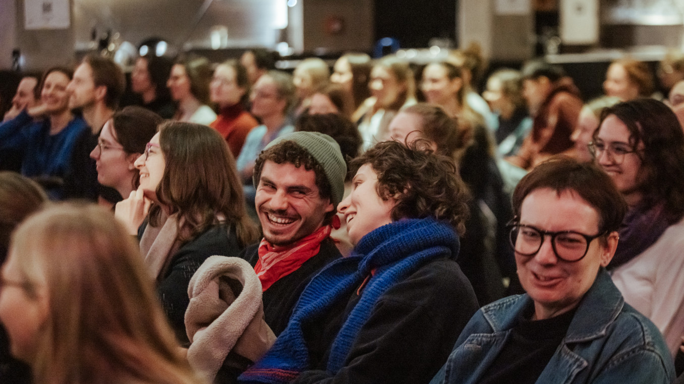 Audience laughing.